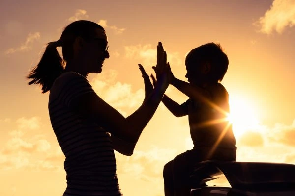 Image of happy mother and child after resolving child arrangements Dyfed